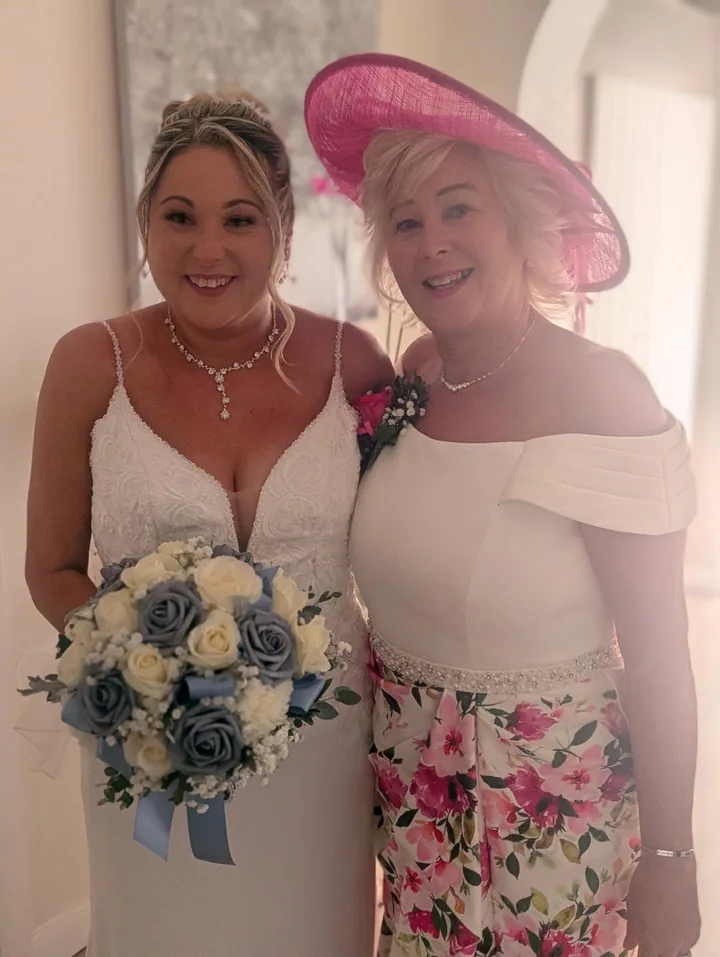 A bride and her mother ready for the wedding, with hair by Hair Up Solutions