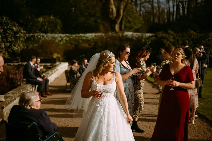 Rebecca enjoying her wedding at Clearwell Castle. Hair by Hair Up Solutions; photograph by Colin Nicholls.